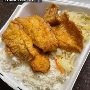 fried tilapia in a styrofoam container