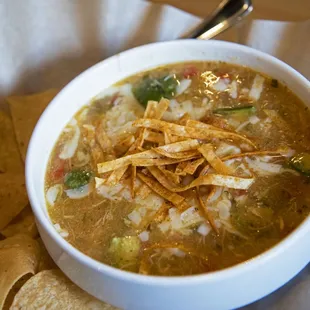a bowl of soup with tortilla chips