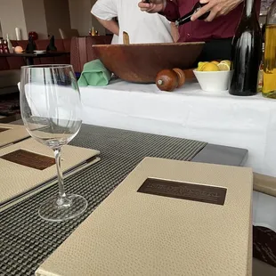 Server  preparing Caesar Salad Prepared Tableside