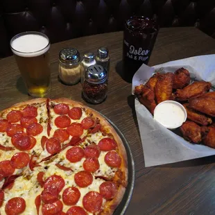 Leaning Tower of Pizza and Hot Wings