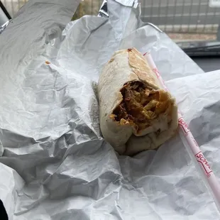  a burrito wrapped in aluminum foil