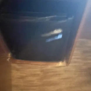 Mini fridge but no outside food or drinks allowed unless sealed.