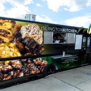 a food truck parked on the side of the road
