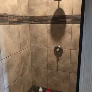 Men's outside guest bathroom has shower