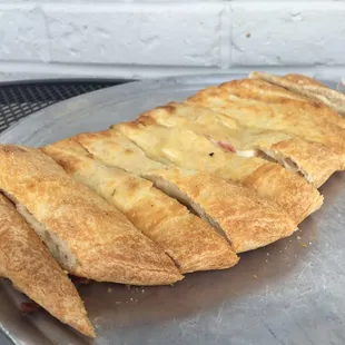 a piece of bread with cheese on it