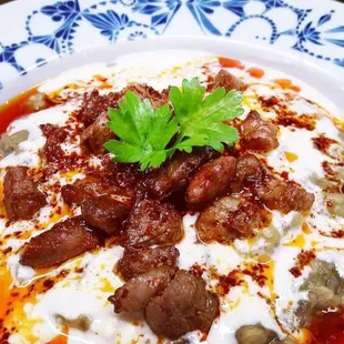 Ali Nazik is a Turkish specialty consisting of sautéed lamb and grilled eggplant over yogurt with garlic and red pepper oil.