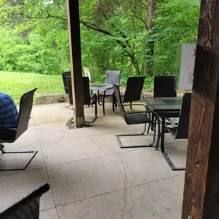 a patio with tables and chairs