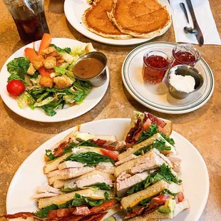 club sandwich, side salad, pancakes, meat lovers scramble