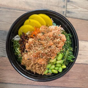 Rice bowl with yellowtail and salmon with most toppings