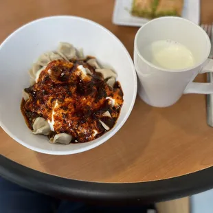 Mant, Small beef dumplings with garlic yogurt sauce and spices.