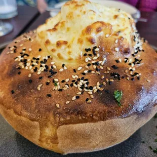 Lamb stew backed with bread on a clay pot