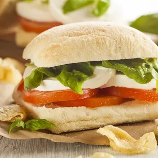 a sandwich with tomatoes and cheese