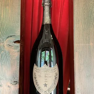 a bottle of wine on a shelf