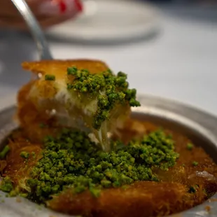 a piece of bread with pesto on it