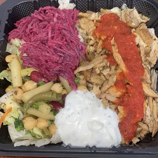 Chicken salad, with beets, chickpeas, white sauce, and spicy red sauce