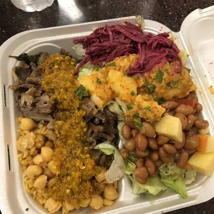 a plastic container with a variety of food items