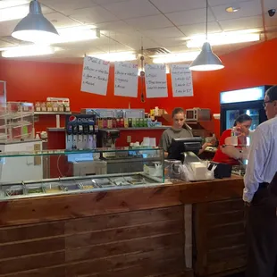 Order and pay in the middle of the counter. Hot items are on the right, cold items on the left.