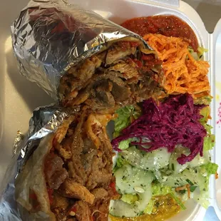 Lamb and chicken wrap with sides and sauces