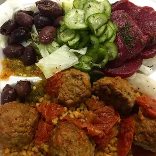 Meatballs with bulgar rice, beets, cucumbers and kalamata olives.