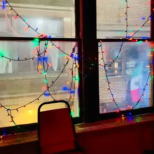 a window with christmas lights