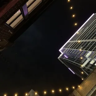 a view of a skyscraper at night
