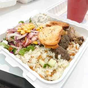 Rice w/ chicken and meatballs, hummus and tzatziki, lettuce cucumber salad w/ onion + cheese + corn. Includes Ottoman Sherbet