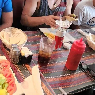 a group of people sitting at a table eating