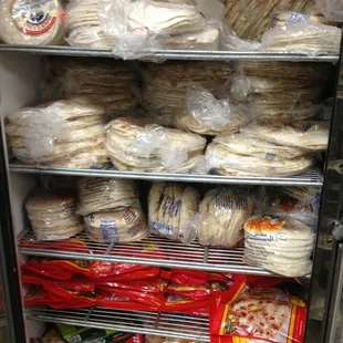 a refrigerator full of bread and other food items