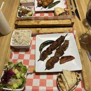 Lamb kebobs and chicken kabobs in the back.