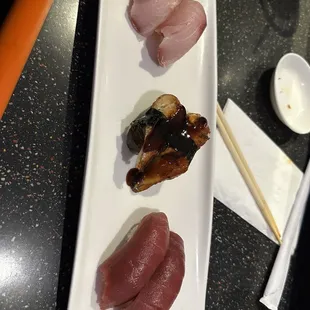 (Top to bottom) hamachi, Unagi, and toro nigiri
