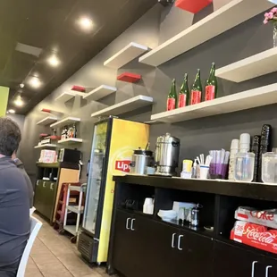 a man sitting at a table in a restaurant