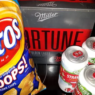 a bag of chips and cans of soda