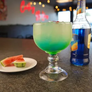 Playa Azul, made with house margarita, mix with pineapple juice, blue curacao and melon liqueur.