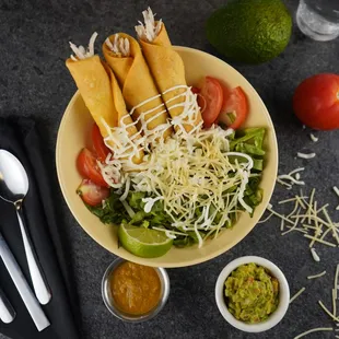 Chicken Flautas, with guac, salsa, sour cream and queso fresco.