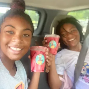 Kids enjoying their "Red Dragon" smoothies w/ edible straws (lemon, chocolate).