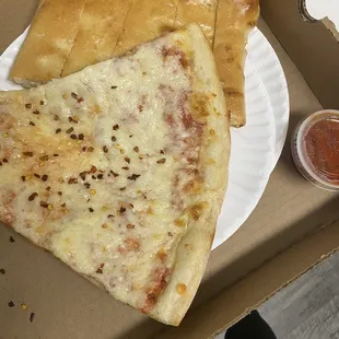 Cheese pizza by slice (good) and cheese bread (okay).