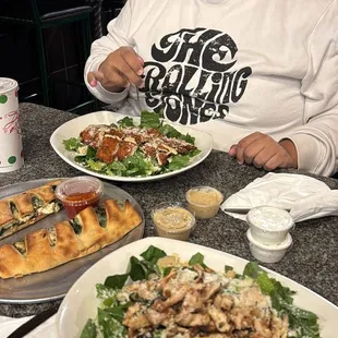 Grilled Caesar Salad and fried chicken Caesar Salad and a spinach Stromboli