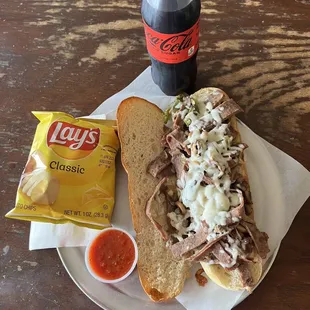 a sandwich and chips on a plate