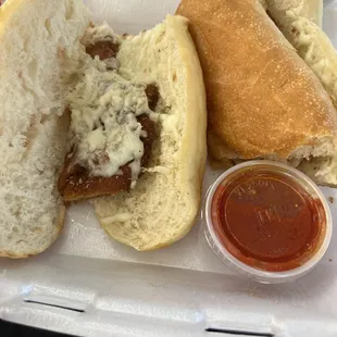 a hot dog with a side of ketchup