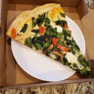 a slice of pizza in a box