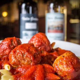 a plate of pasta and meatballs
