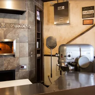 a kitchen with a pizza oven