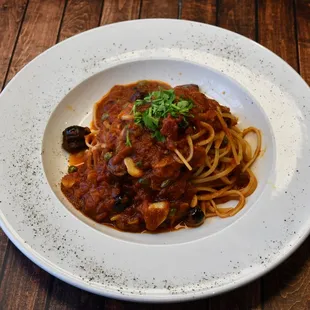 LINGUINE PUTTANESCA,
Sautéed anchovies, black olives, capers, garlic, and parsley 
in a marinara sauce