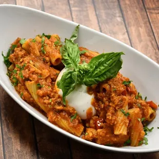RIGATONI GODFATHER,
Ground Italian sausage, red wine, oregano, and Burrata 
cheese in tomato sauce