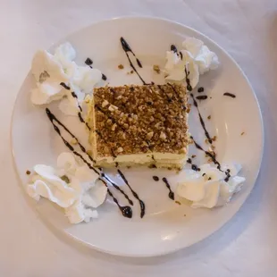 a piece of cake and whipped cream