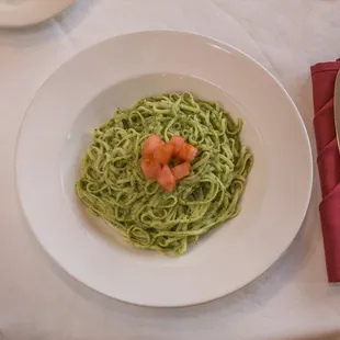 a plate of pasta with shrimp