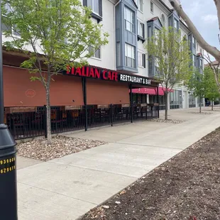 a sidewalk in front of a restaurant