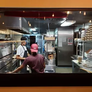 two men working in the kitchen