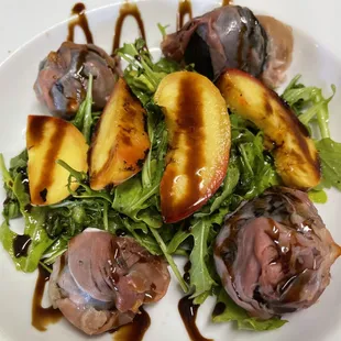Black mission figs, goat cheese, prosciutto , arugula salad with grilled peaches, balsamic glaze