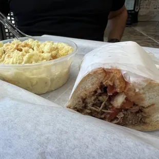 Smoked pulled brisket sandwich and potato salad